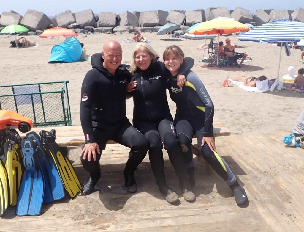 Discover Scuba Diving participants smiling after a shore dive experience with full scuba gear