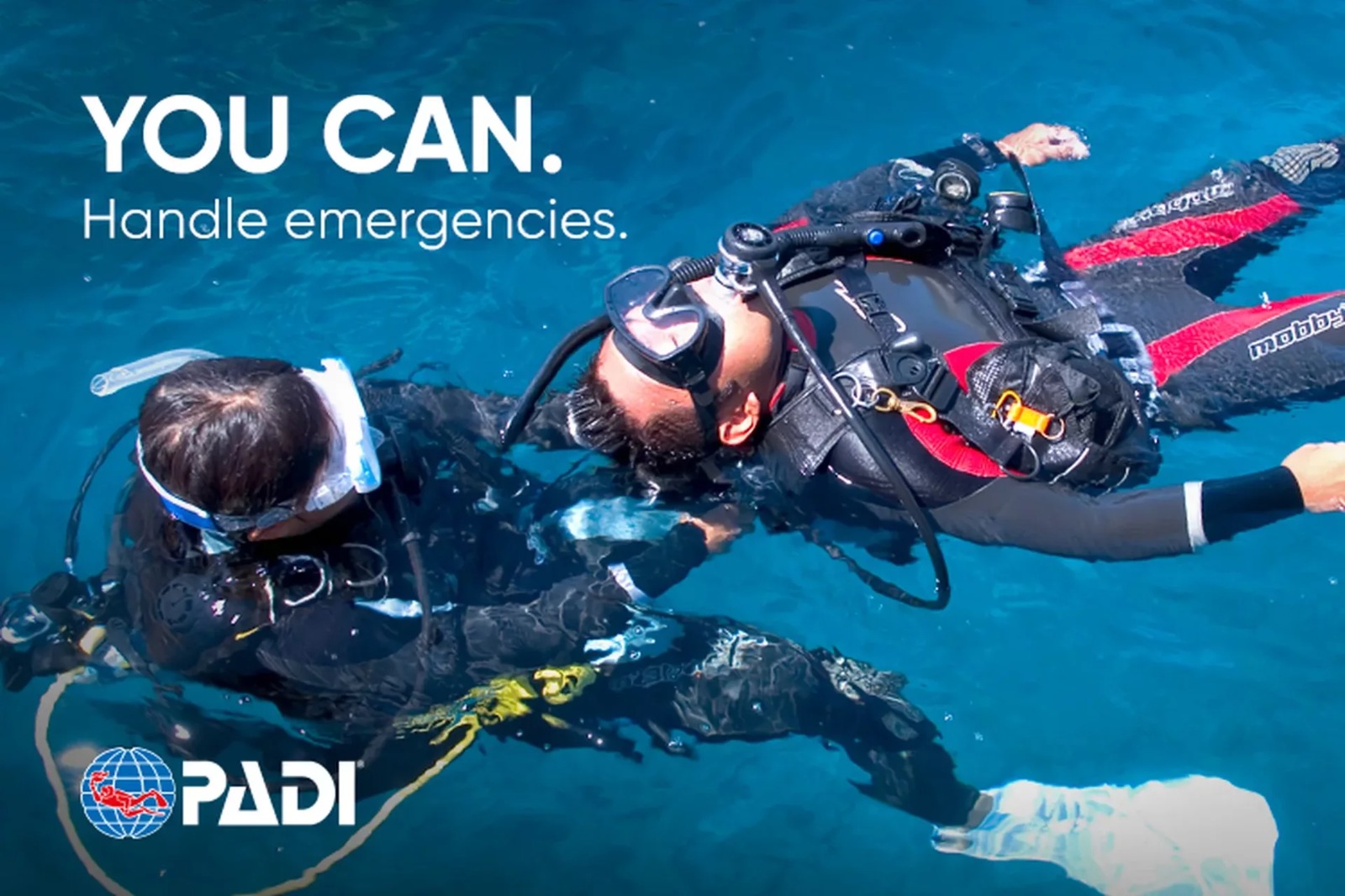 PADI Rescue Diver training showing a diver assisting another diver during an emergency scenario